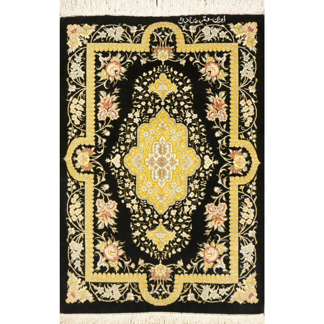 Signed Qum silk rug 77 × 57 cm, floral medallion on black ground, full view – Djoharian 13195