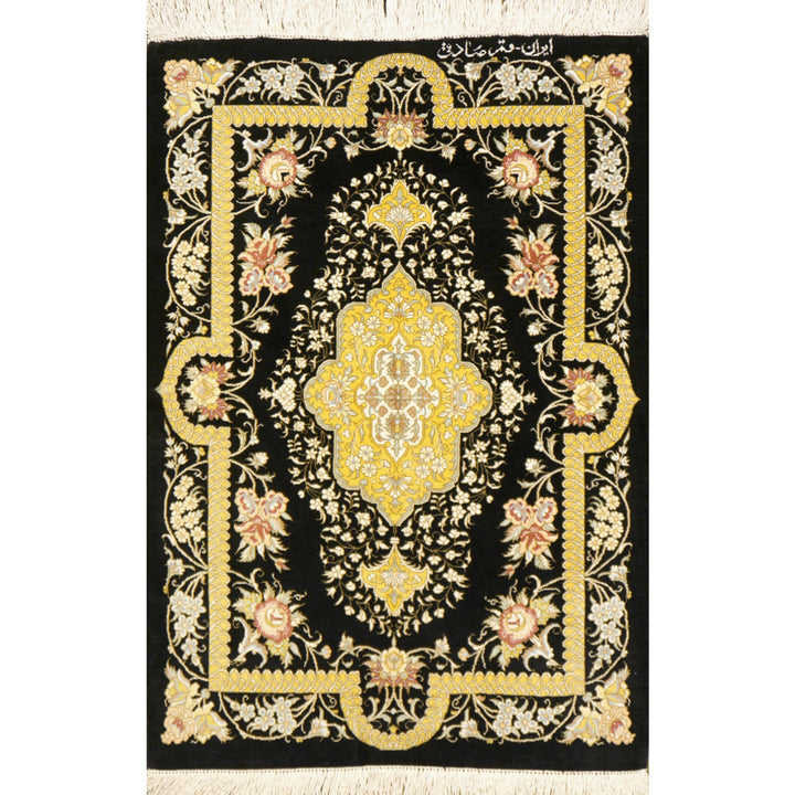 Signed Qum silk rug 77 × 57 cm, floral medallion on black ground, full view – Djoharian 13195