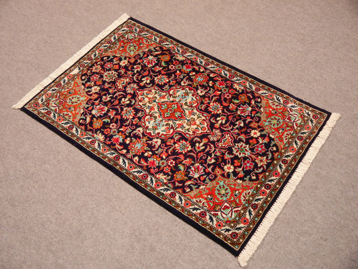 Luxury Persian silk Ghom rug displayed as an exclusive wall hanging or gallery piece.
