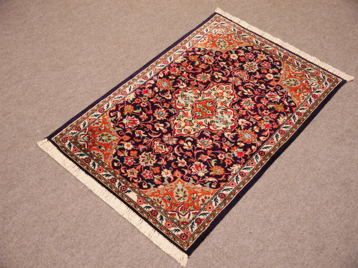 Luxury Persian silk Ghom rug displayed as an exclusive wall hanging or gallery piece.