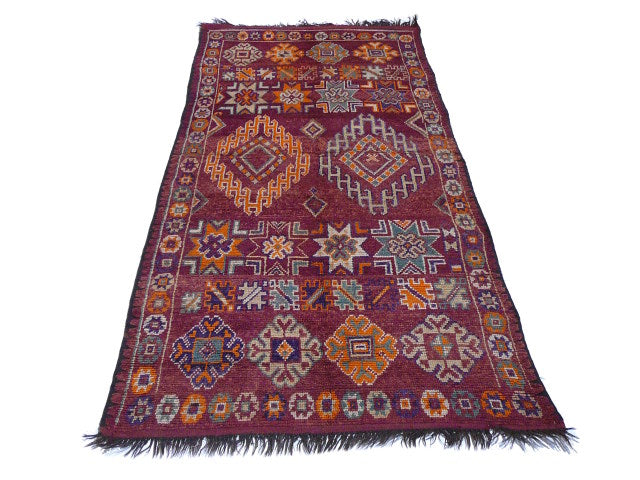 Boujad Berber rug — berry and orange field close-up