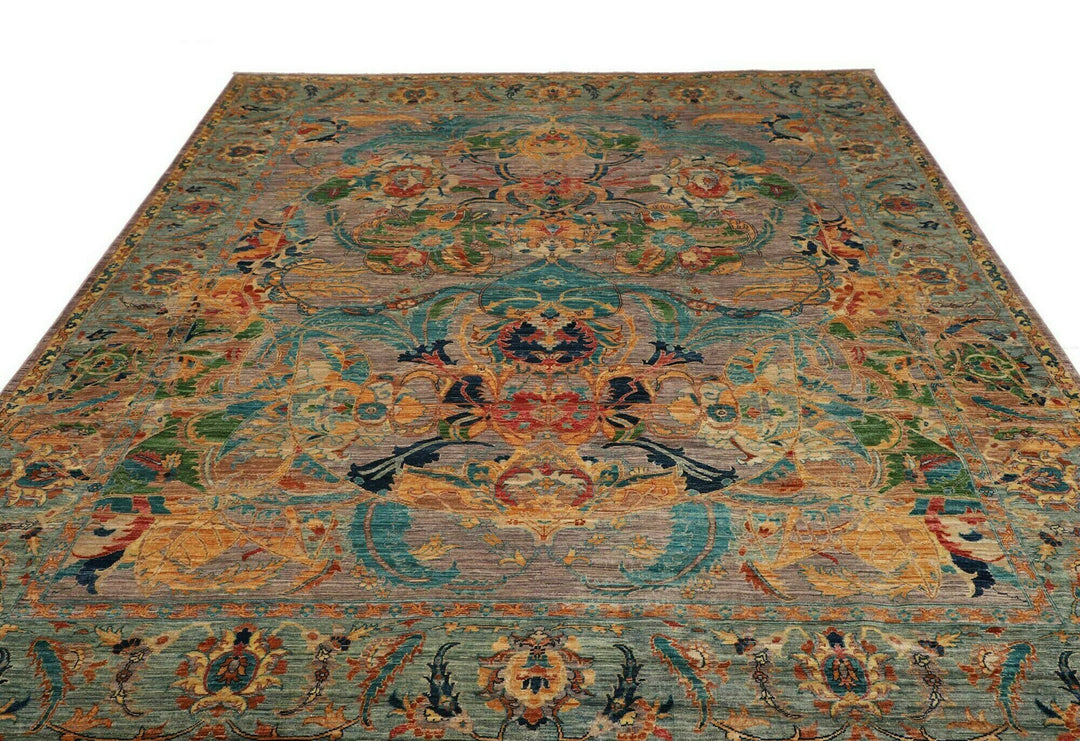 This beautiful rug originated in rural Afghanistan, where it was hand-knotted by tribal weavers. The pile material is handspun wool that has been dyed with vegetable and mineral pigments. The motifs are made of silver-colored bamboo silk. It is of excellent quality with a subtle sheen and elegant organic colors. The design comes from ancient Persia. The style of this rug is known as a polonaise pattern and is typical of antique rugs from the Safavid Dynasty in the late 16th century. 