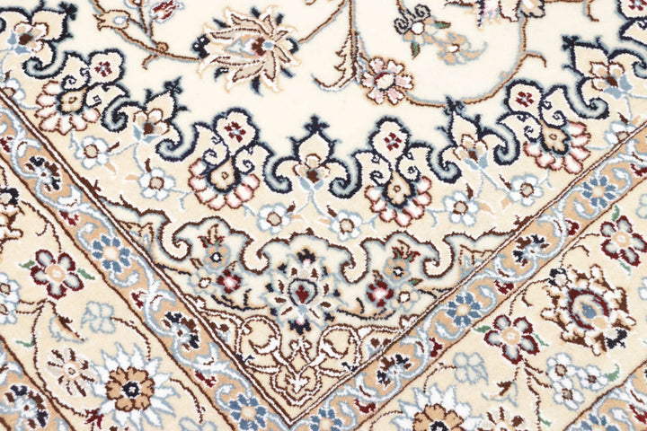 This fine, Persian rug is a typical piece in the popular traditional Nain design. The colors are a wool white field, beige border and light blue accents. The size is 203 x 132 cm, the quality is 9la. The round Medaillon is floral like the field and corners.