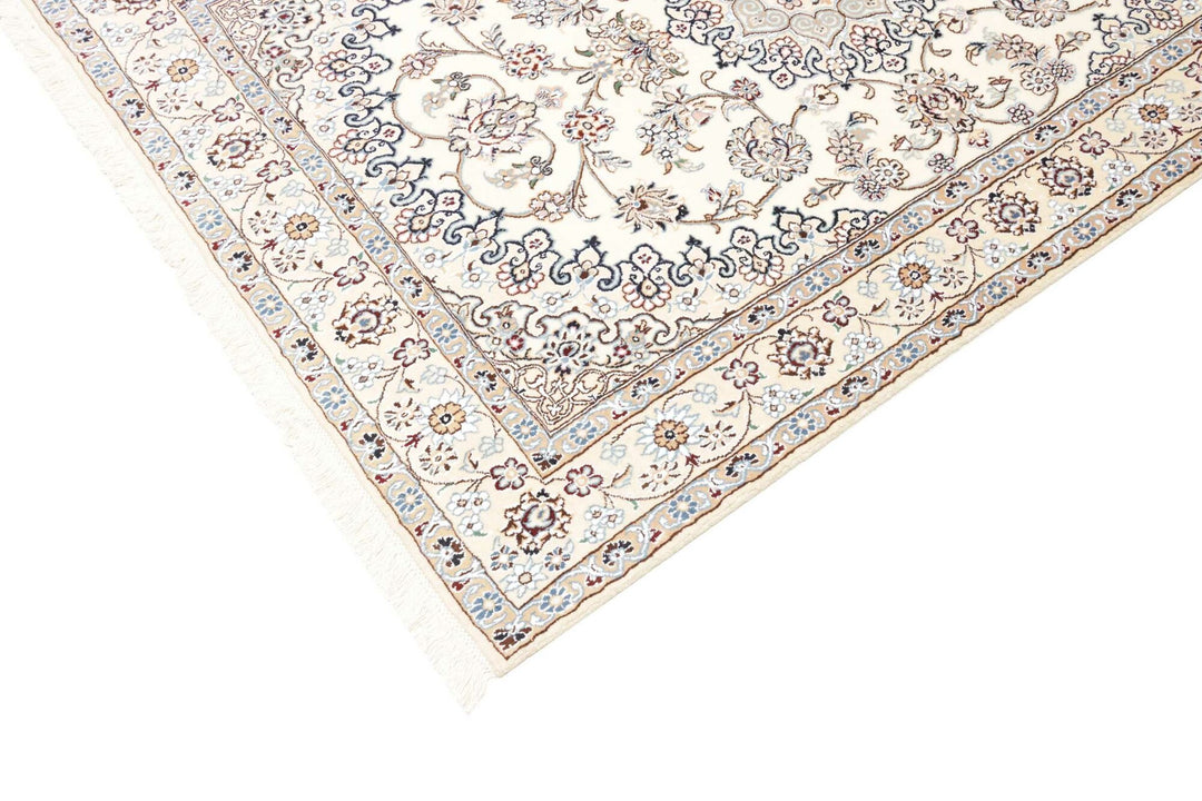 This fine, Persian rug is a typical piece in the popular traditional Nain design. The colors are a wool white field, beige border and light blue accents. The size is 203 x 132 cm, the quality is 9la. The round Medaillon is floral like the field and corners.