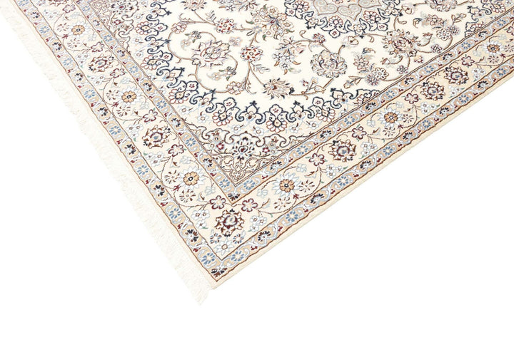 This fine, Persian rug is a typical piece in the popular traditional Nain design. The colors are a wool white field, beige border and light blue accents. The size is 203 x 132 cm, the quality is 9la. The round Medaillon is floral like the field and corners.
