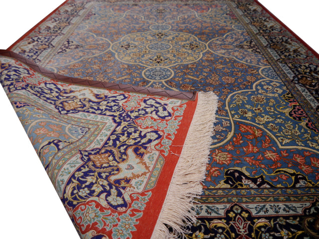 Qum silk rug — angled view, Djoharian #12233