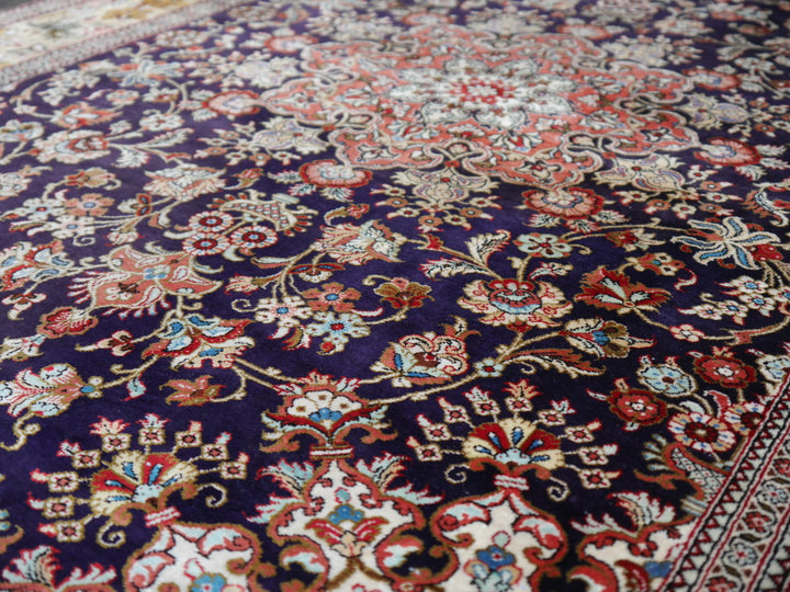 Qum pure silk rug - collectors item Classic vintage silk rugs Origin: Qum Design: Floral with medaillon Colors: indigo blue, gold, red, green Pile hand-knotted 100% pure natural mulberry silk Size: small rugs - also for wall decoration Age: Approx. 1970/80 Condition: Very good, side edges and fringes rstored, freshly washed  Knot density: 600 kpsi